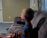 Both boys bouncing on the couch